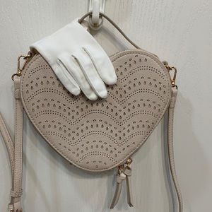 Lauren Conrad, heart shaped purse color cream